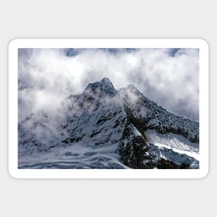 Savage cloud covered mountain Sticker